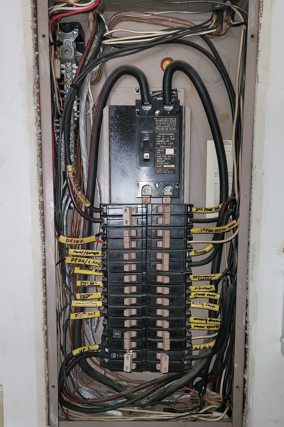 Electrical panel with labeled circuits after upgrade by Apex Facility Services.