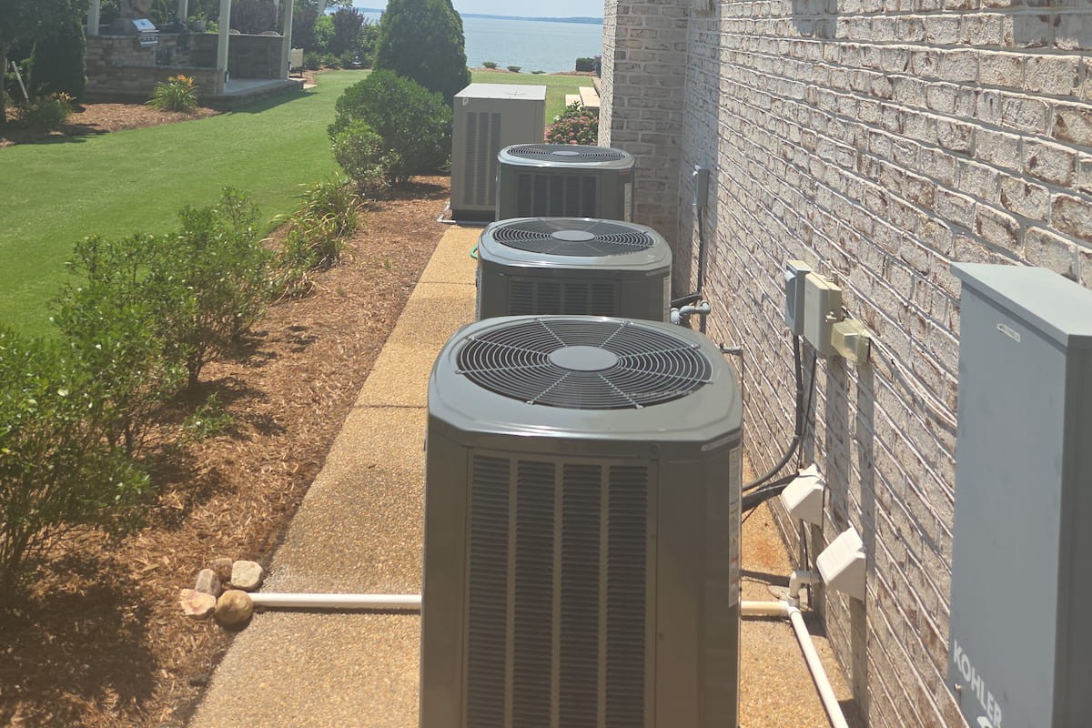 Multiple AC condenser units serviced at a Hampton Roads waterfront home.